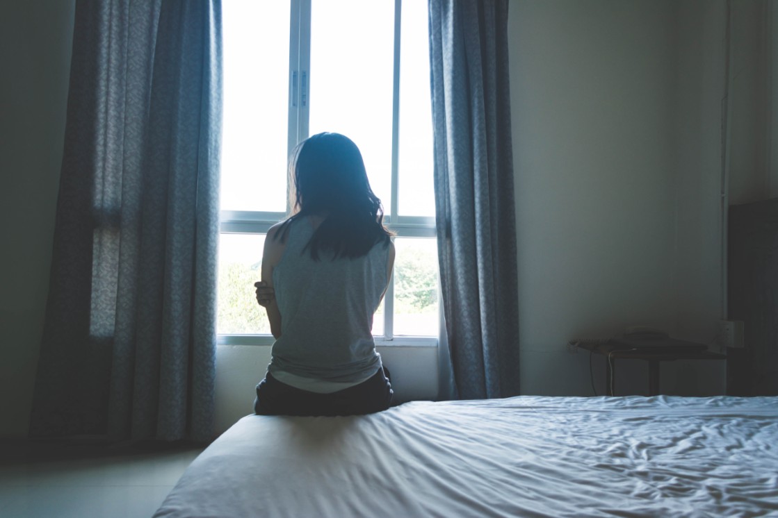 Photo of Woman looking out window