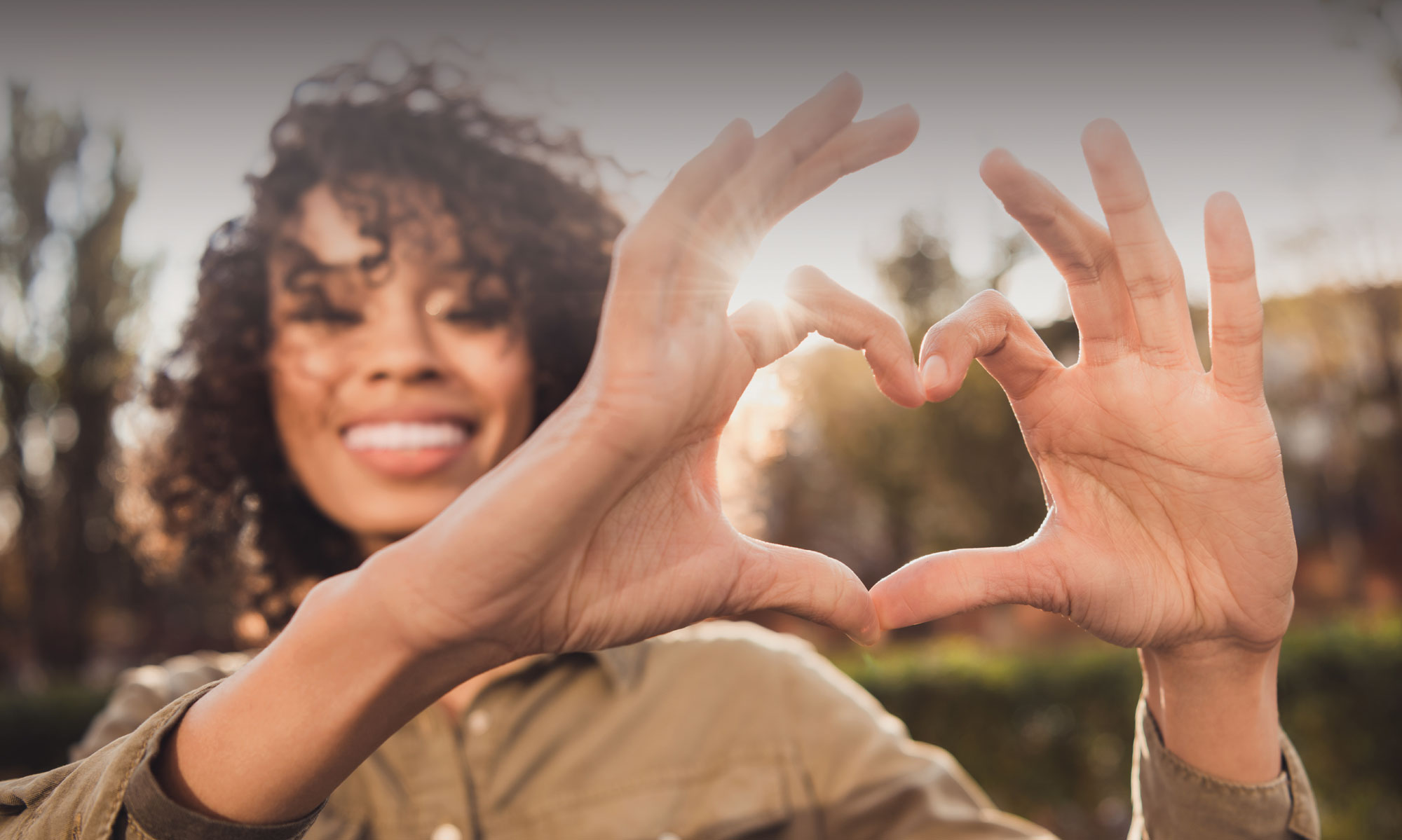 Young girl with heart hands Young girl with heart hands
