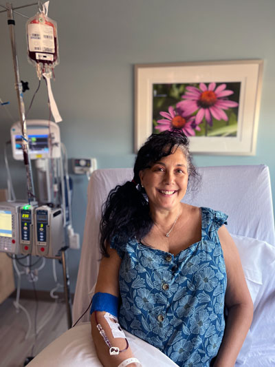 Senior woman in hospital getting blood