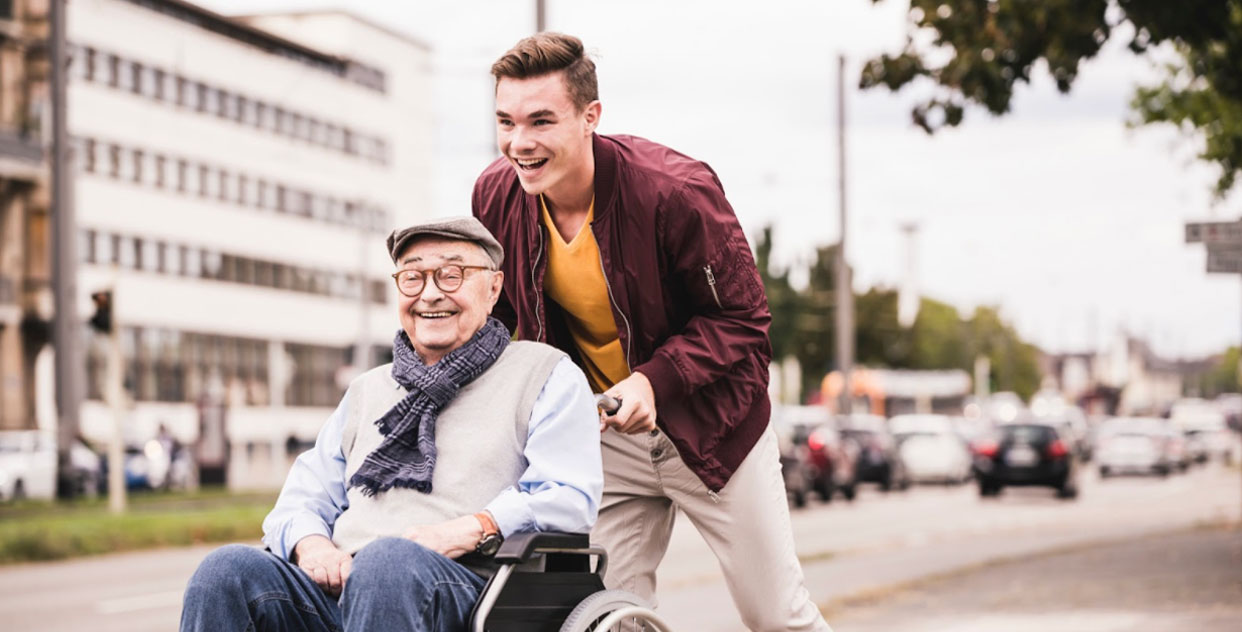 Grandpa getting pushed in wheelchair