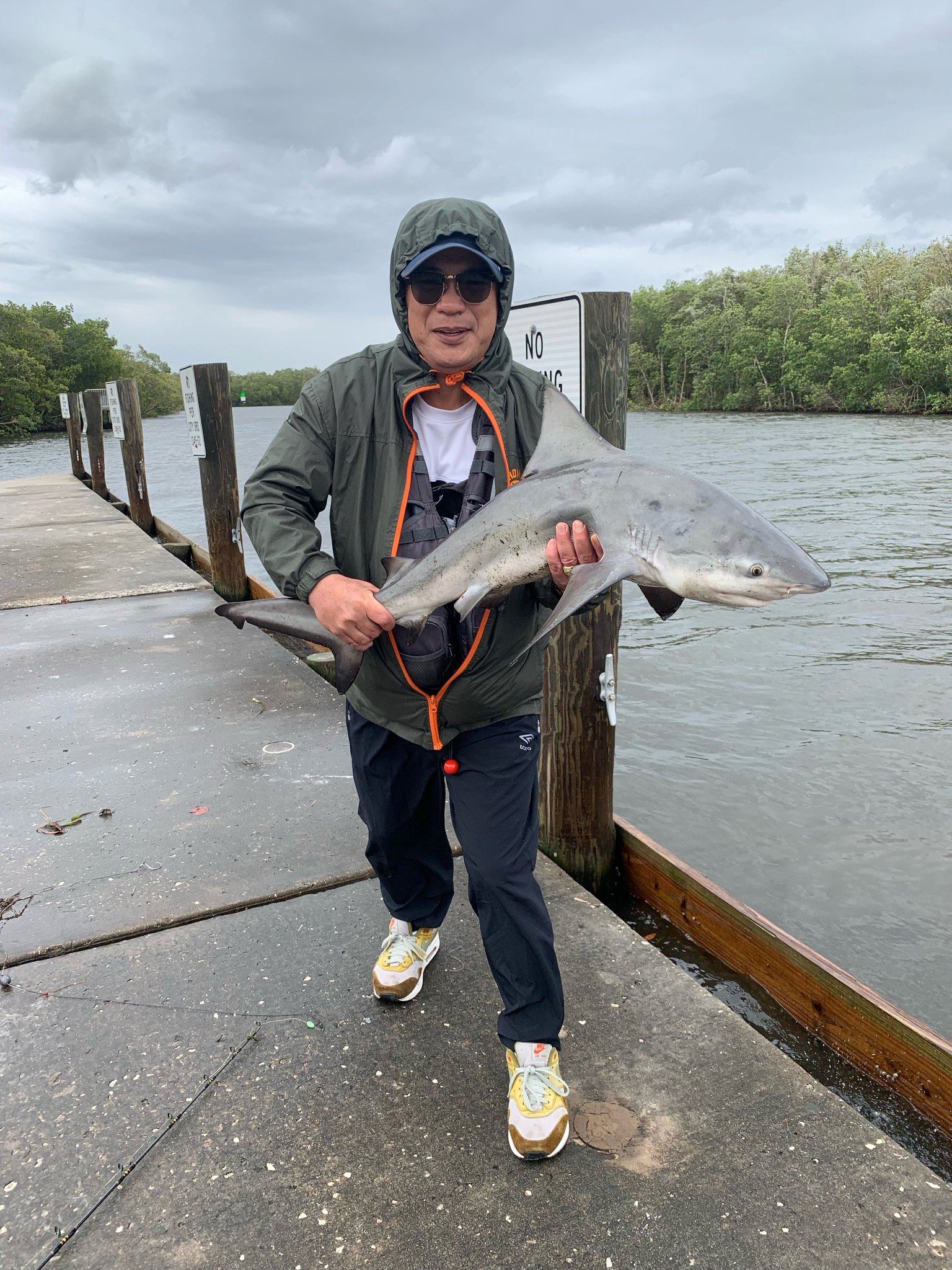 Dr. James Zozobrado showing a fish he caught